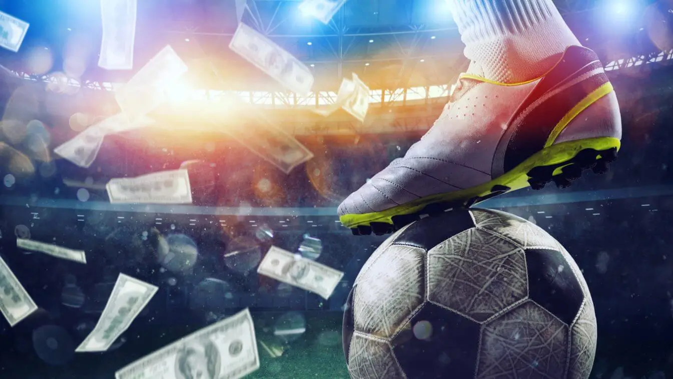 image of a footballer with their foot on the ball and money raining down from the sky